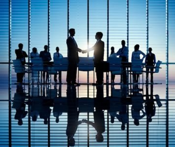 two-businessmen-having-together-with-theri-colleagues_53876-19912